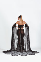 Mermaid signature dress in black latex and tulle worn with cape sleeves handcrafted in 3D tubes