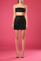 Black embroidered crop top and skirt with sheer pink jacket