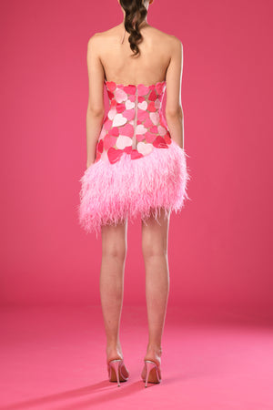 Asymmetrical pink mini dress with embroidered hearts and feathers