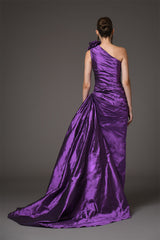 Asymmetrical draped purple taffeta dress with flower detailing on shoulder back view