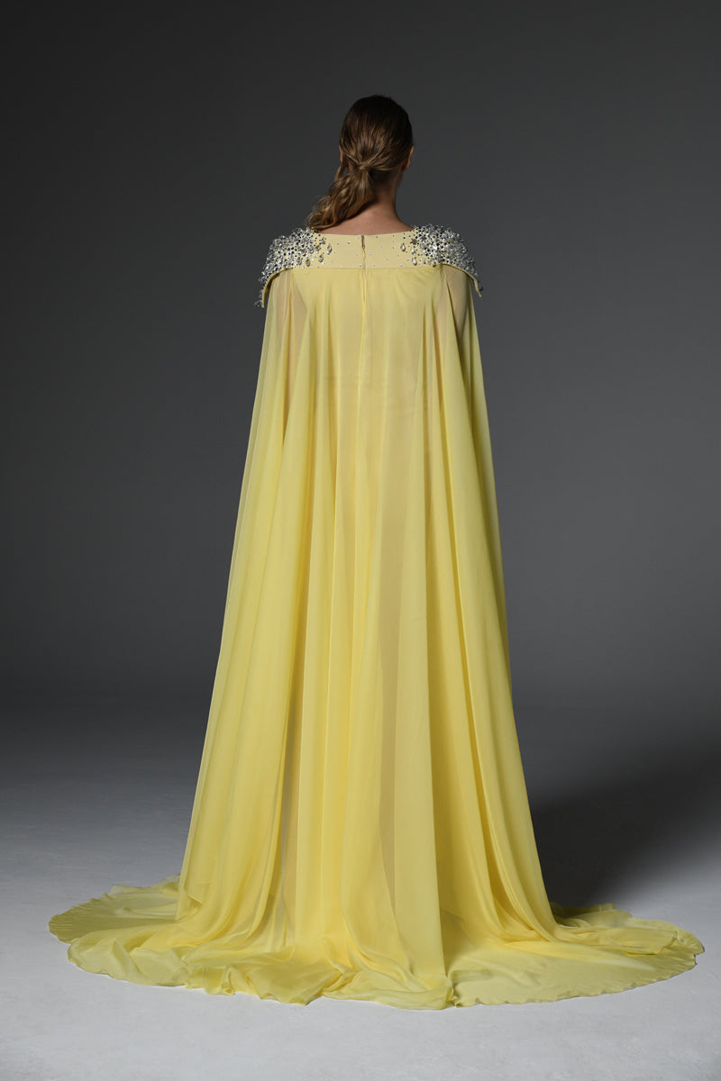 Yellow embroidered crêpe dress featuring chiffon cape