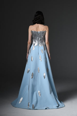 Light blue crêpe dress with feathers on bustier