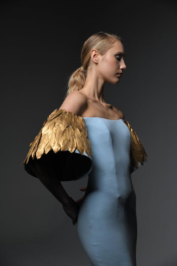 Light blue crêpe dress with feathers on sleeves