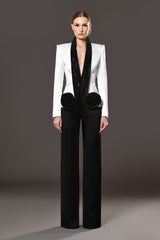 White radzimir long sleeved structured blazer with black crystal chainmail collar and flower detail with black radzimir pants