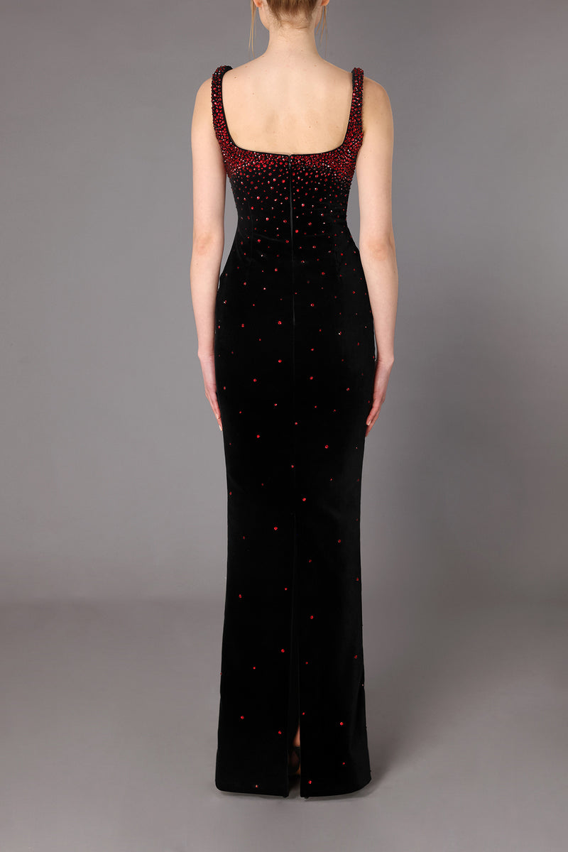 Fitted black velvet dress with deep red stones