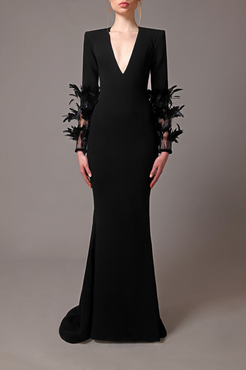 Black crêpe dress with feathers on long sleeves
