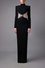 Long sleeved black crêpe dress with side cutouts embroidered with baguette crystals