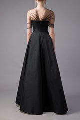 Black taffeta A-line dress with crystal embroidery on bust and black sheer tulle