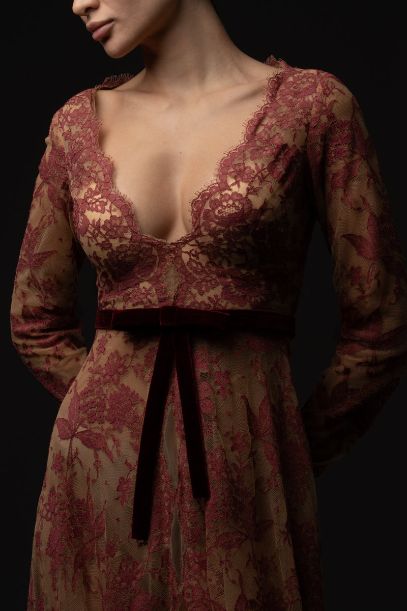 V neckline lace gown featuring a velvet belt