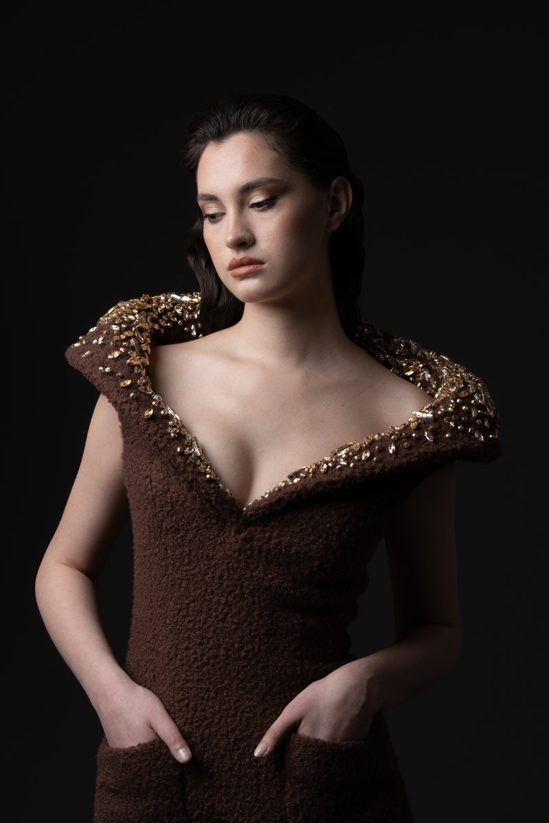 A fitted bouclé  dress with beaded statement collar.