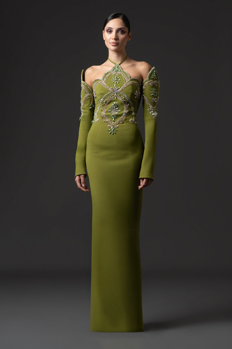 Fitted gown featuring a pointed neckline and matching sleeves