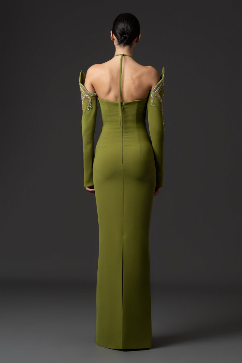 Fitted gown featuring a pointed neckline and matching sleeves