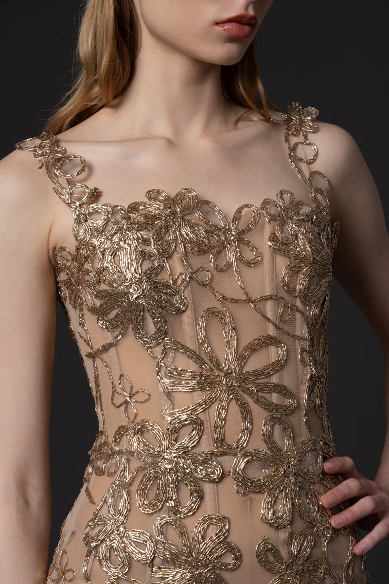 A fitted raffia embroidered corseted dress