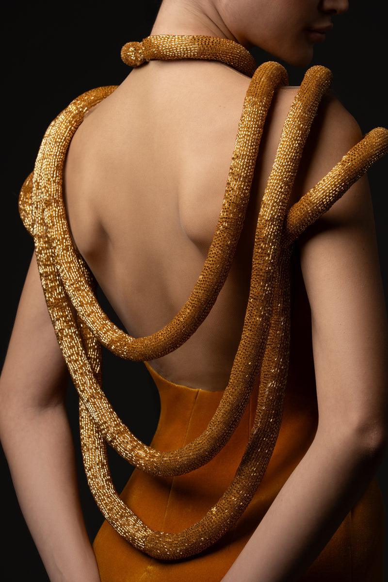 Velvet dress featuring a plunging neckline detailed with embroidered-hoop bust