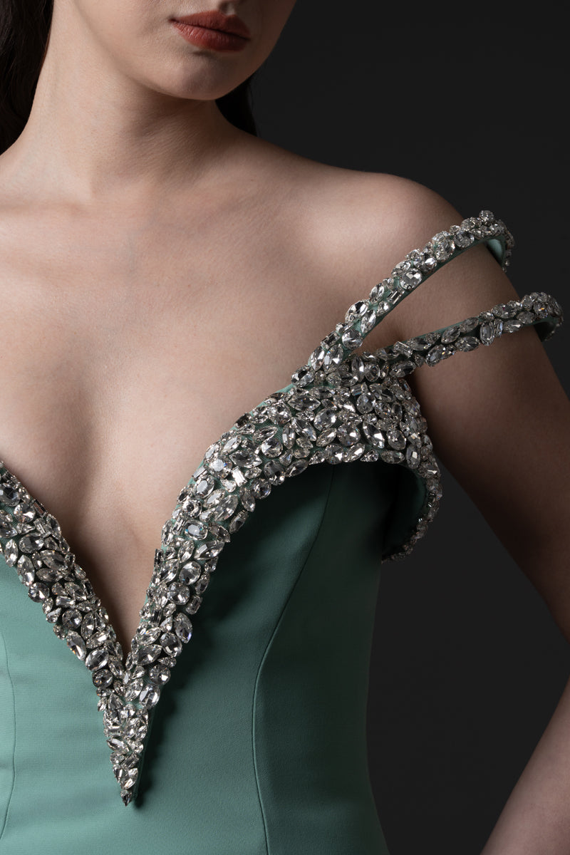 A mermaid gown, featuring off-the-shoulder beaded straps