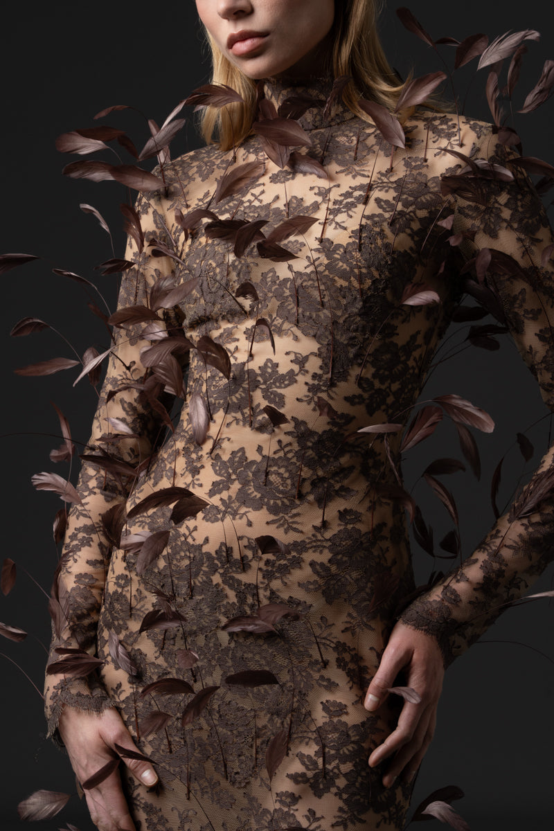 A mermaid long sleeves lace dress with feathers