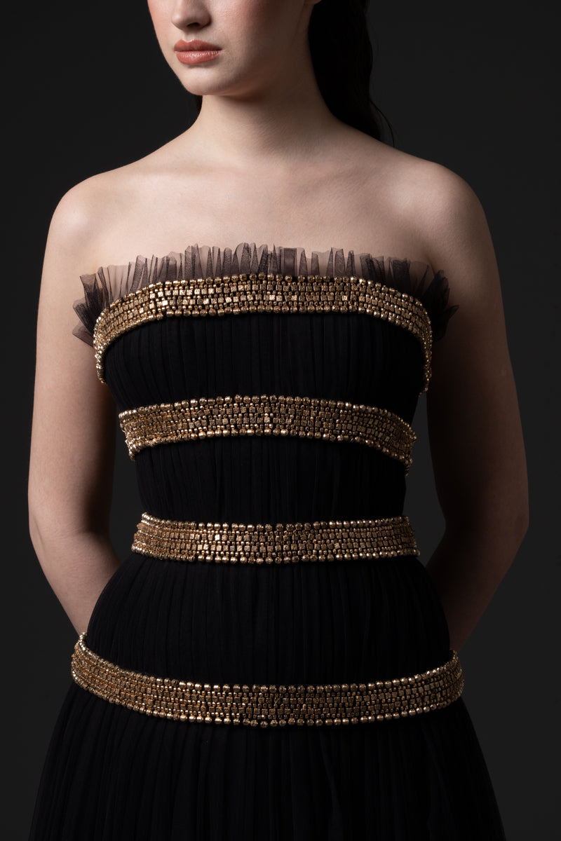 A strapless tulle gown beaded with metallic stones