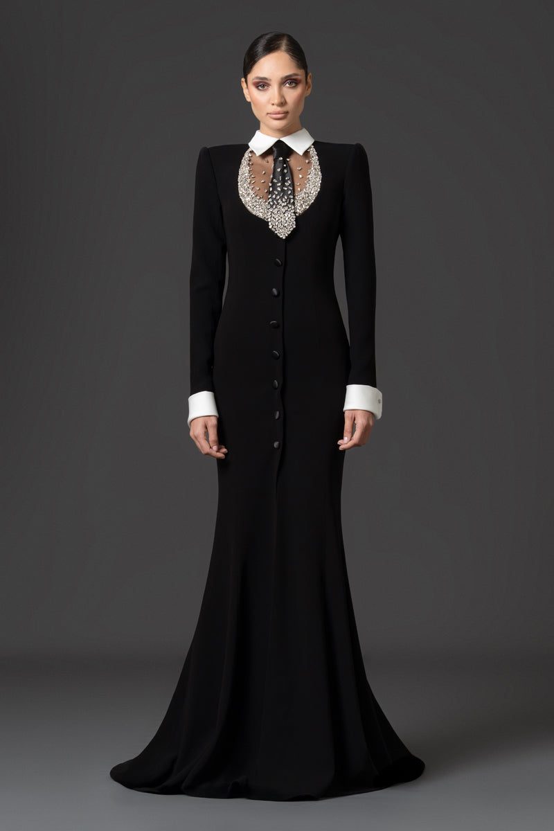 Tuxedo-inspired mermaid dress featuring a sharp matching collar and cuffs.