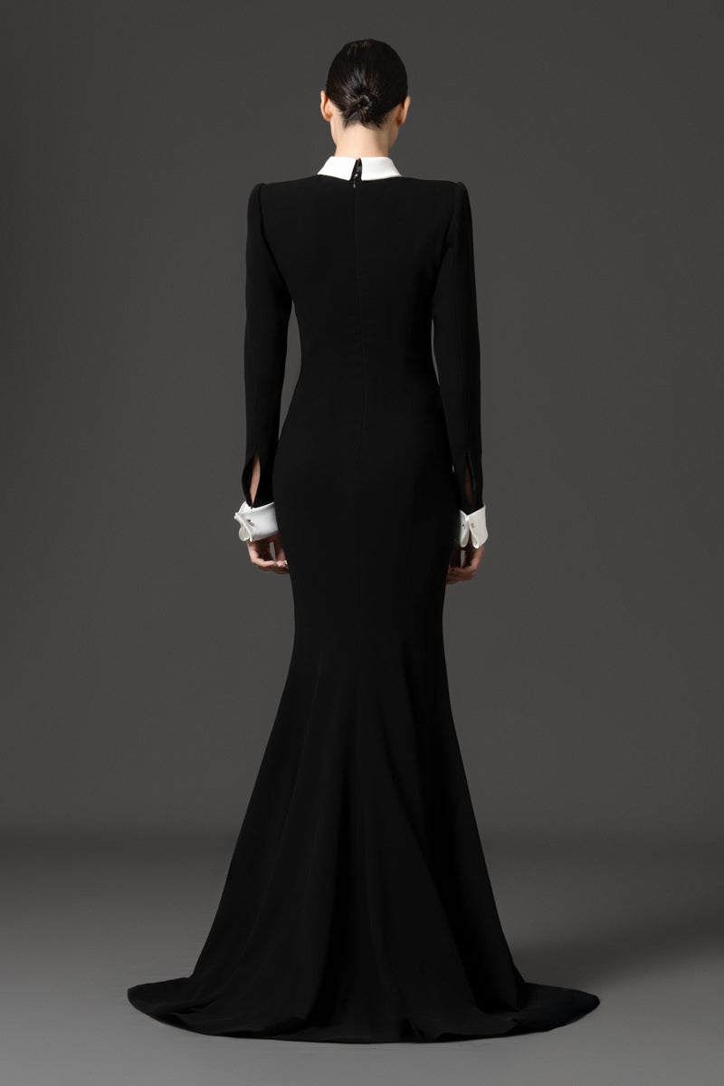 Tuxedo-inspired mermaid dress featuring a sharp matching collar and cuffs.