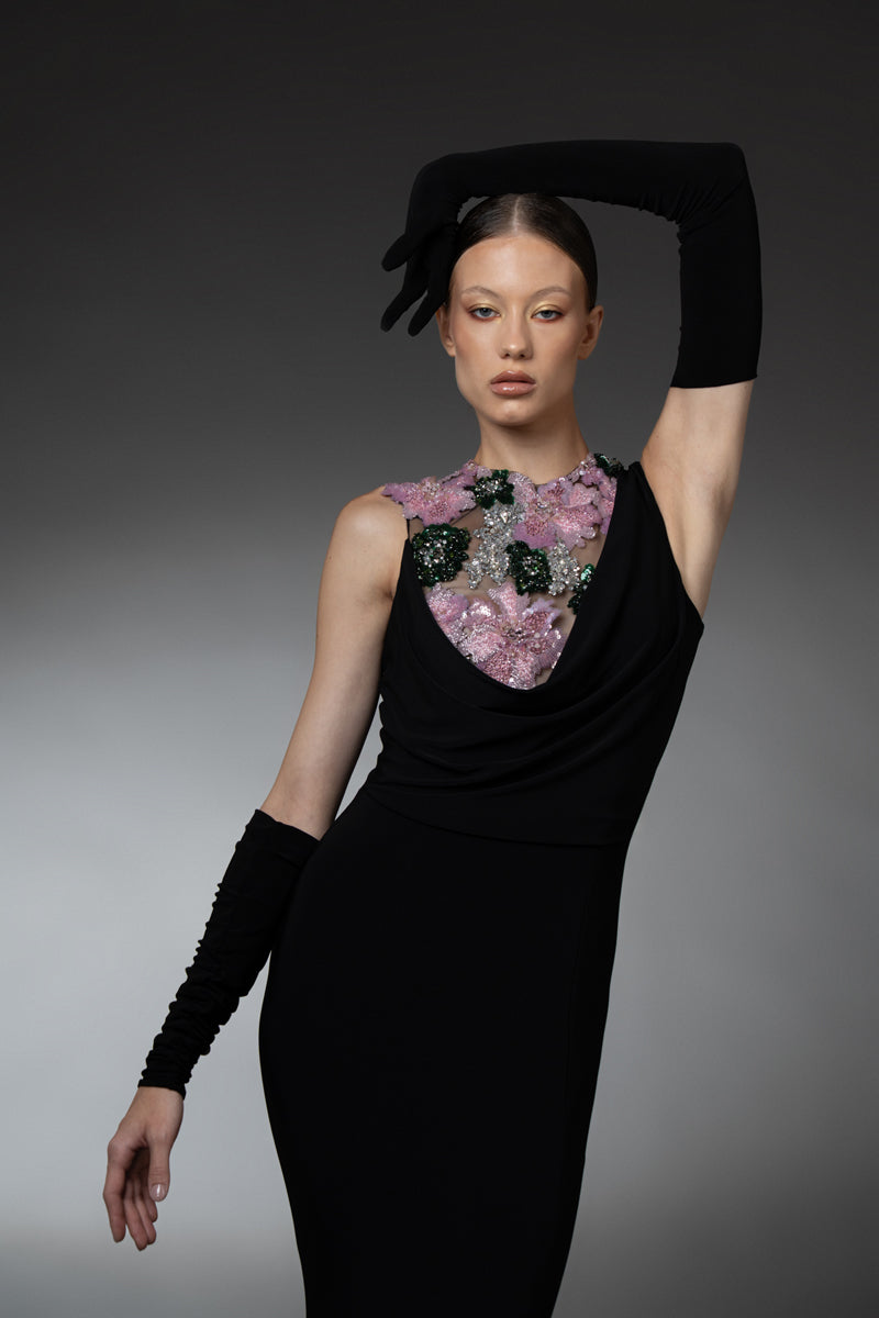 Black jersey dress with gloves, featuring floral embroidery on the bodice