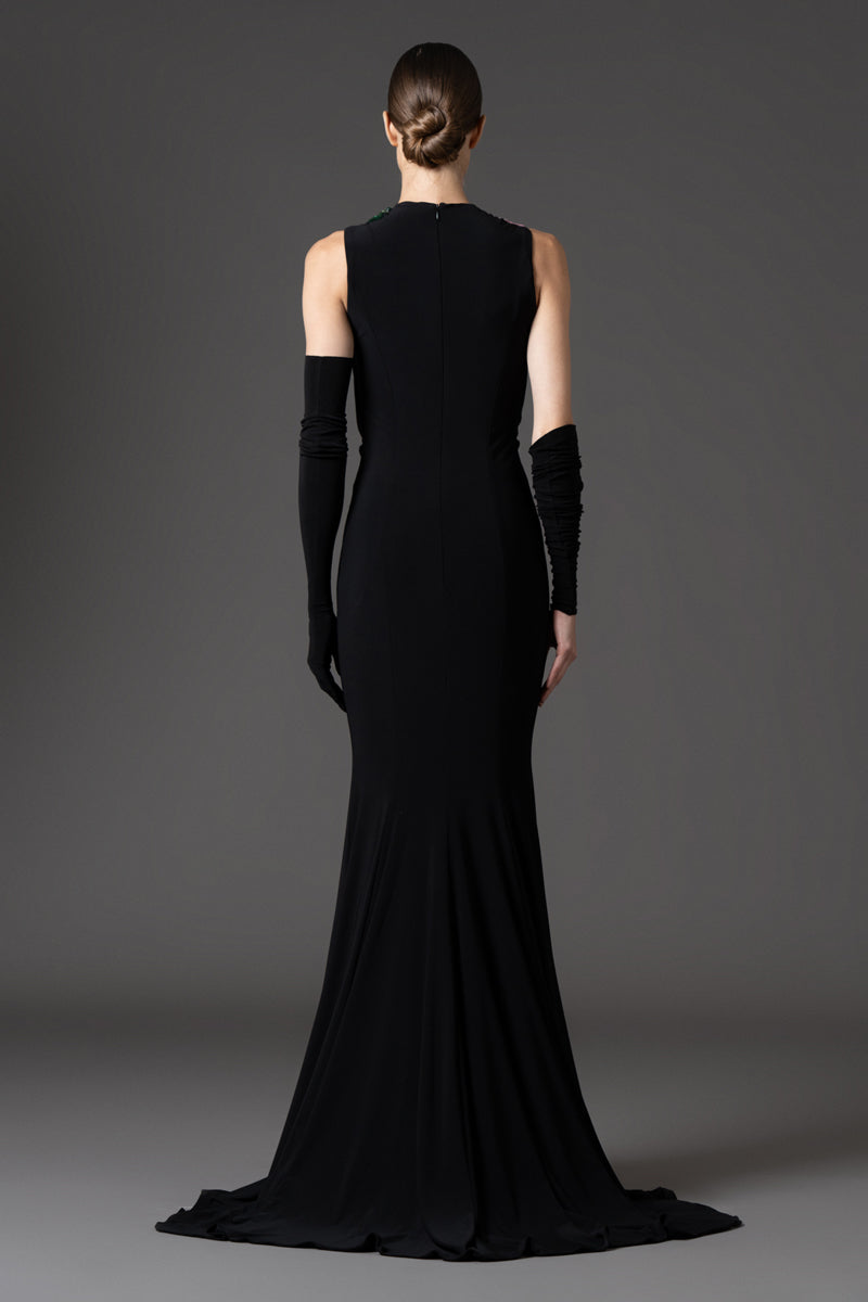 Black jersey dress with gloves, featuring floral embroidery on the bodice