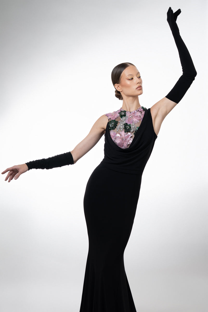 Black jersey dress with gloves, featuring floral embroidery on the bodice