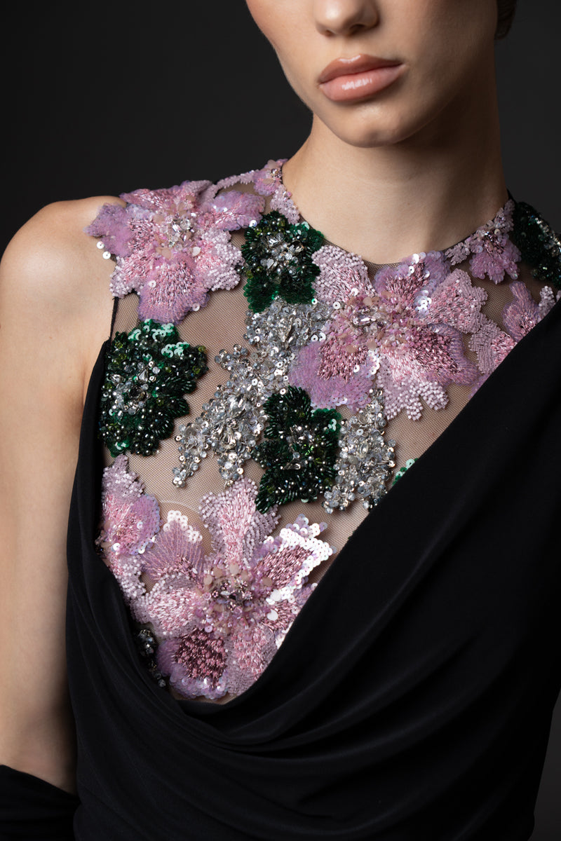 Black jersey dress with gloves, featuring floral embroidery on the bodice