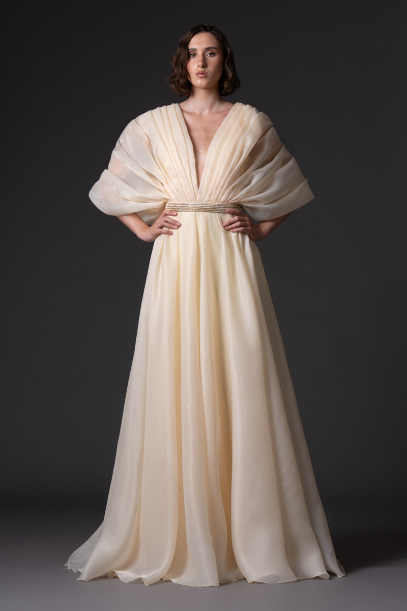 Buttercup yellow organza dress with voluminous sleeves and baguette embroidered belt