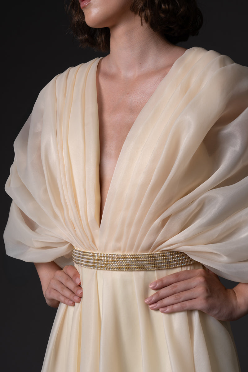 Buttercup yellow organza dress with voluminous sleeves and baguette embroidered belt closeup