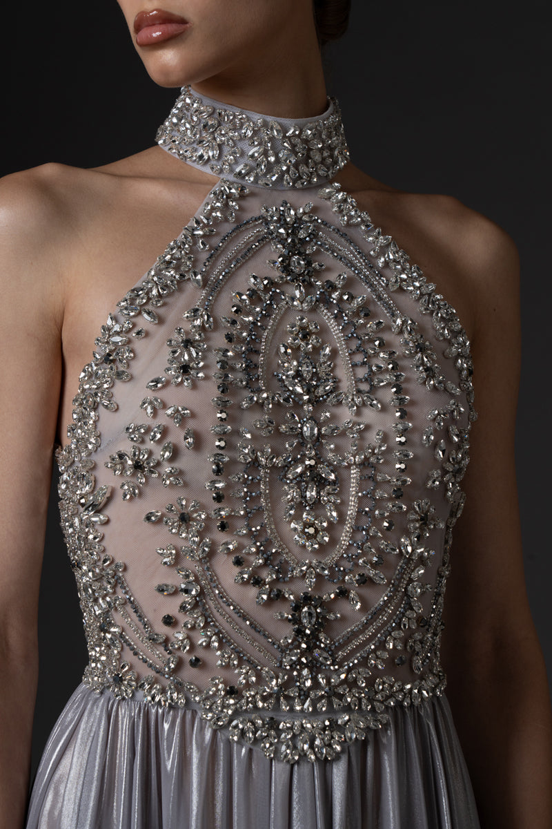 Halter neck dress in flowing silver chiffon lamé, featuring a crystal  embroidered bodice.