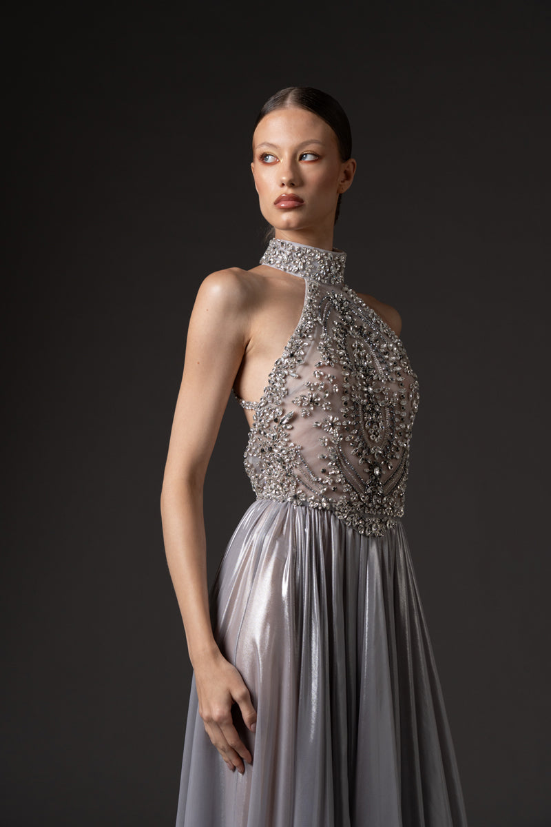 Halter neck dress in flowing silver chiffon lamé, featuring a crystal  embroidered bodice.