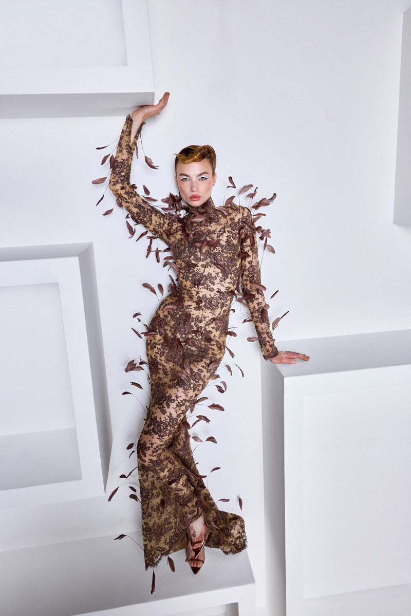 A mermaid long sleeves lace dress with feathers