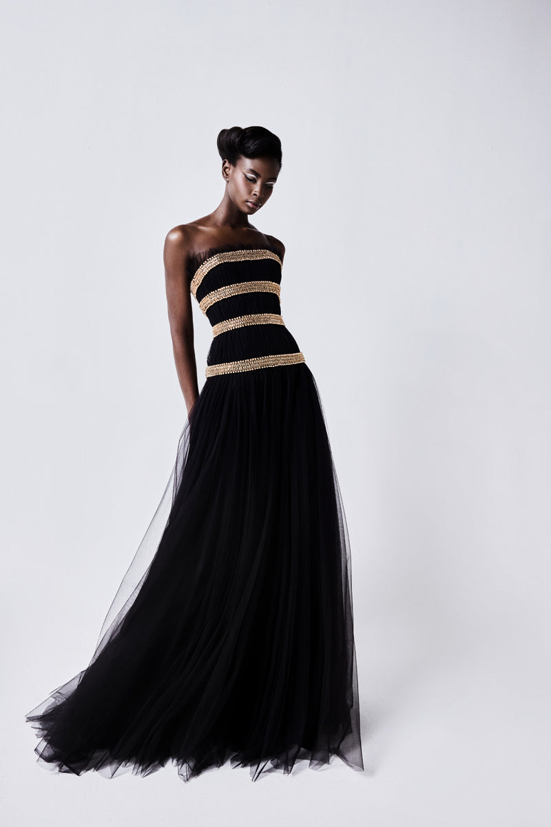A strapless tulle gown beaded with metallic stones