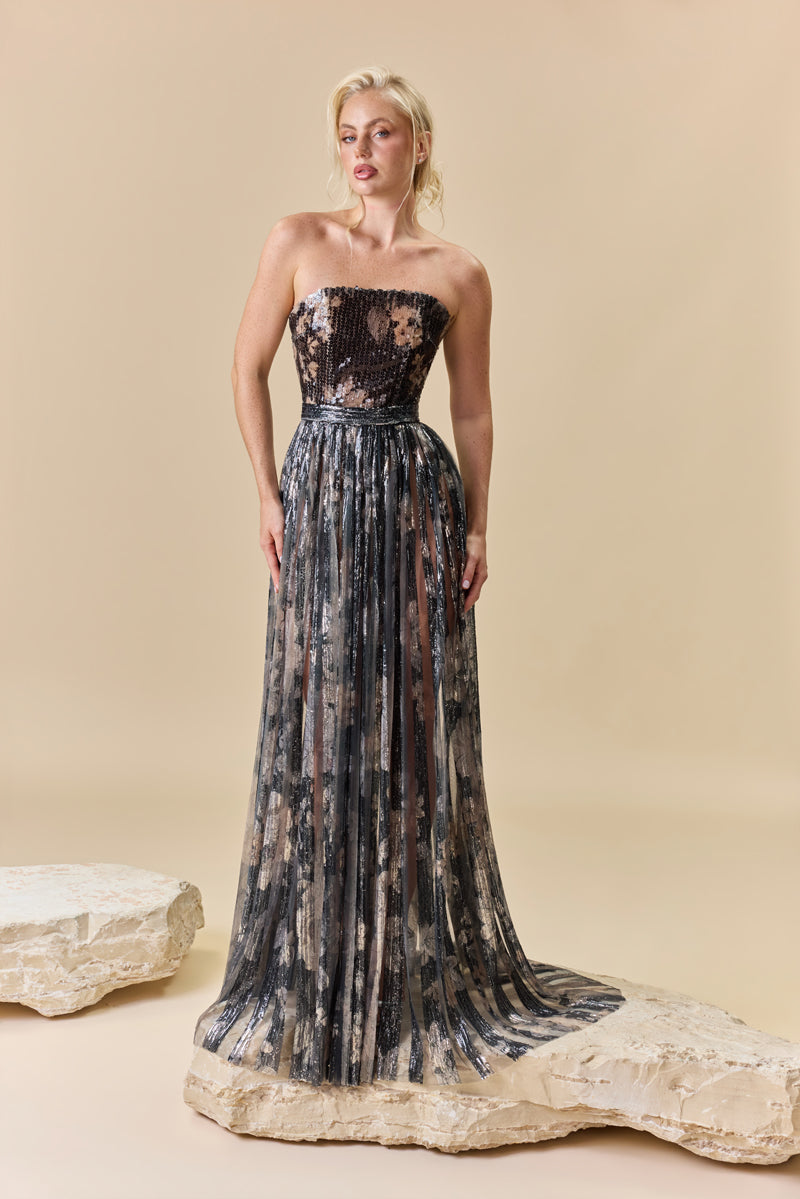 A strapless printed sequins A-line dress with a flowing cape.