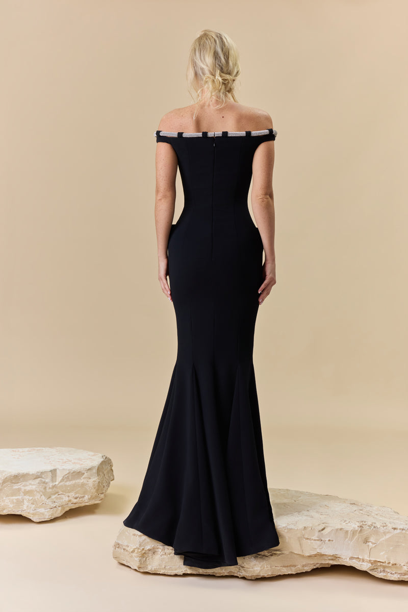 An off-shoulder crêpe fitted dress with pockets and a beaded chord detail along the neckline.
