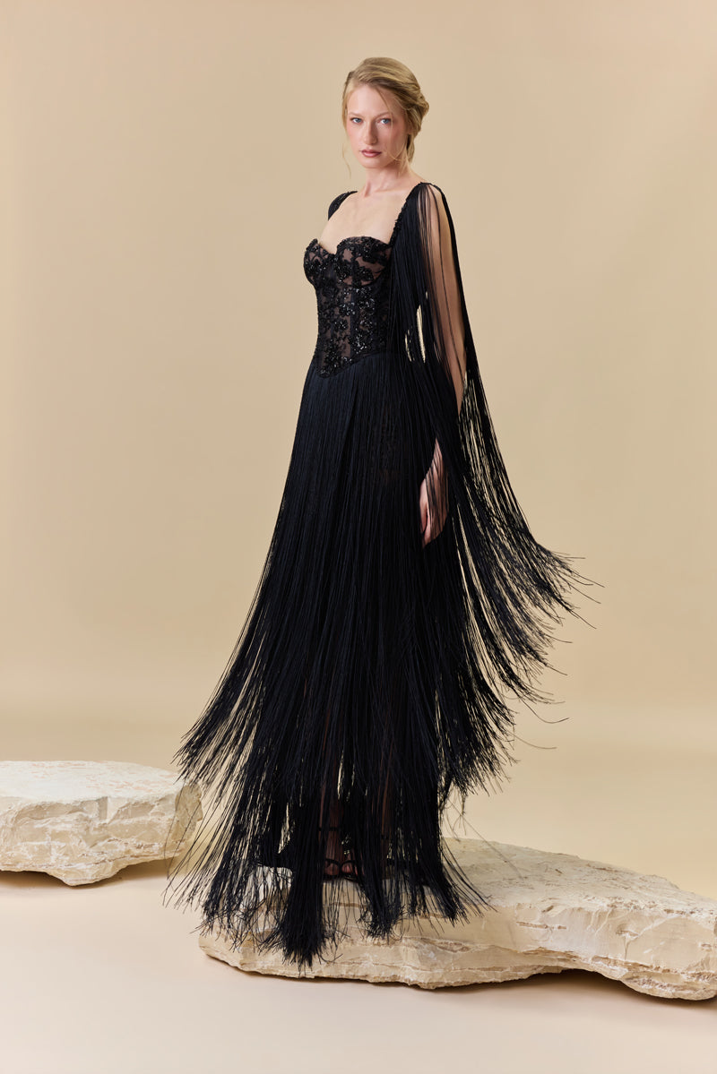 A heart shape fully beaded corset with silk fringes on the skirt and shoulders.