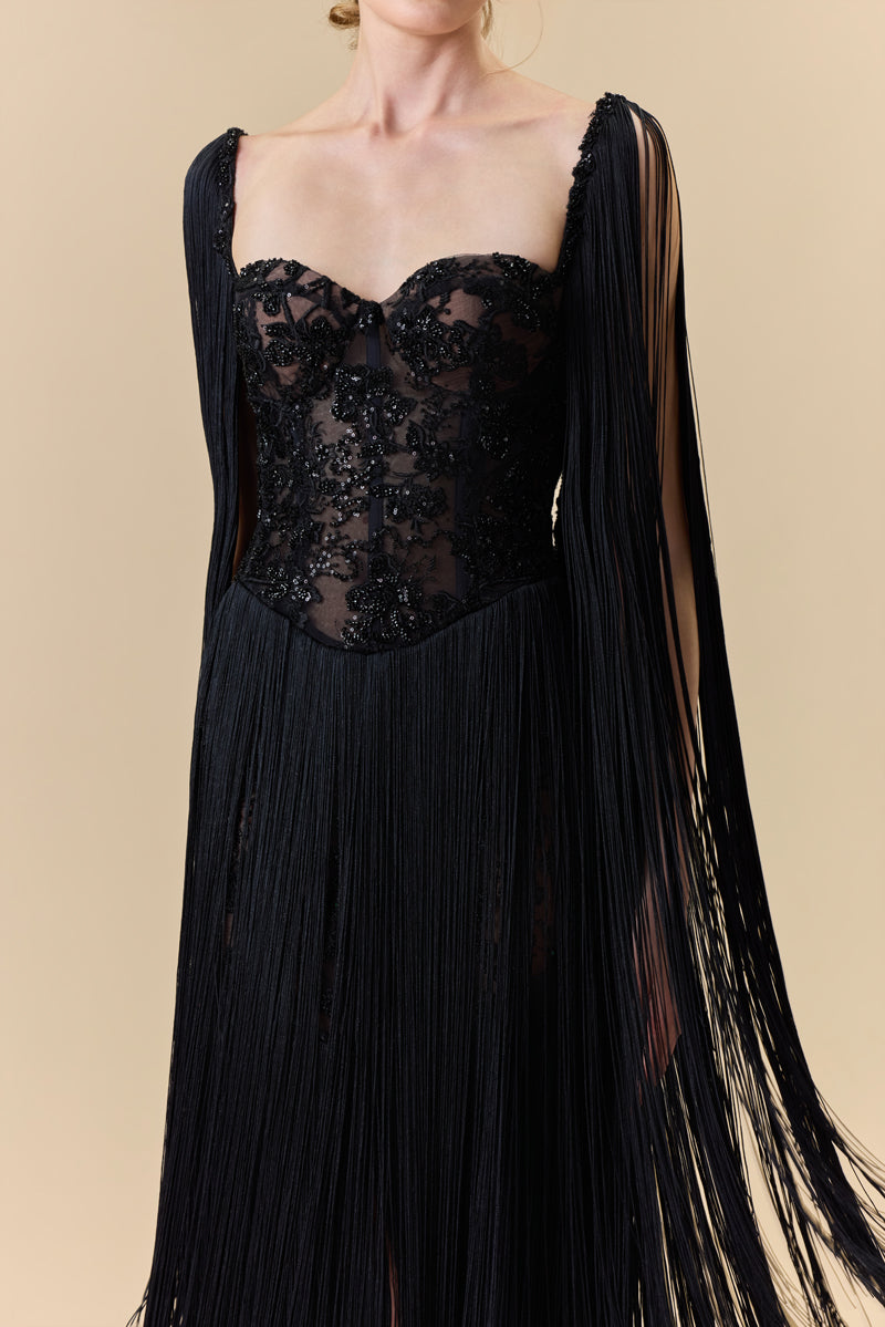 A heart shape fully beaded corset with silk fringes on the skirt and shoulders.