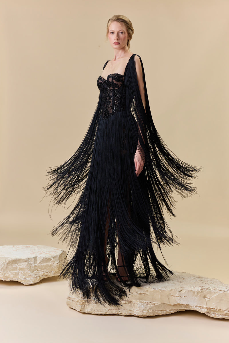 A heart shape fully beaded corset with silk fringes on the skirt and shoulders.