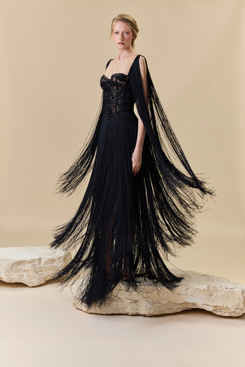 A heart shape fully beaded corset with silk fringes on the skirt and shoulders.