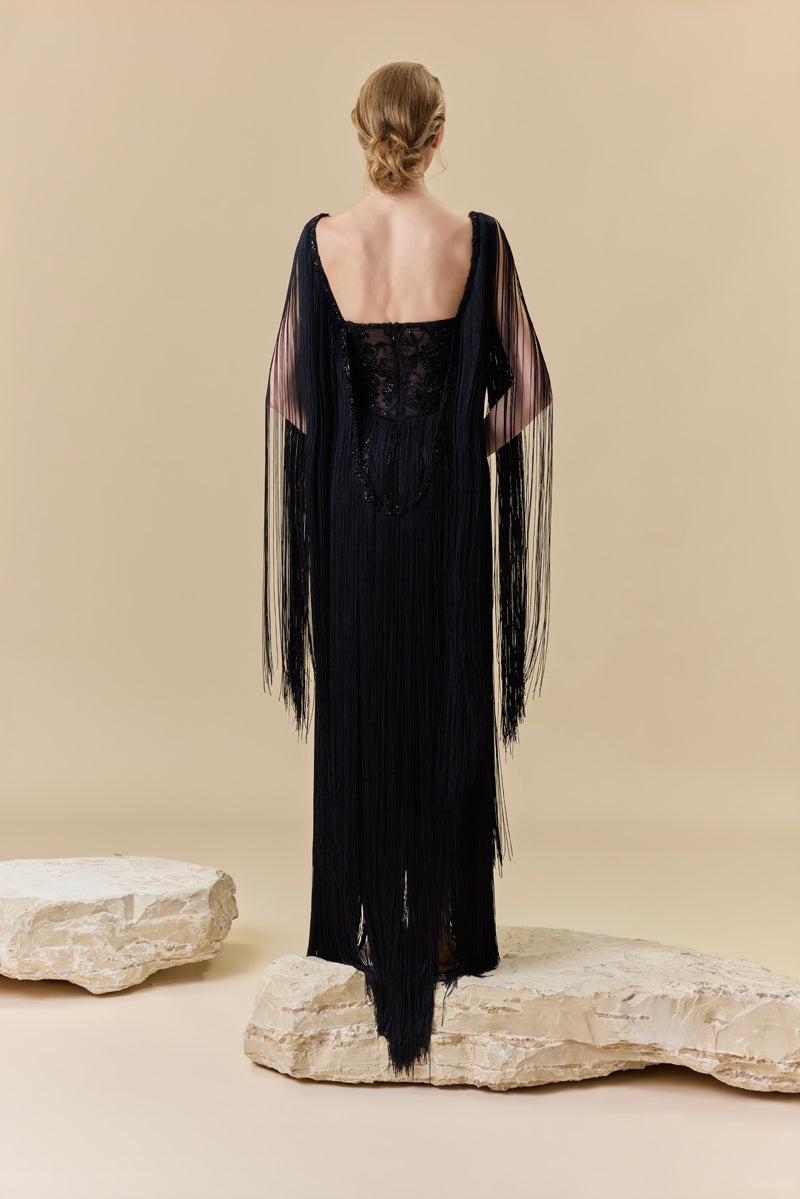 A heart shape fully beaded corset with silk fringes on the skirt and shoulders.