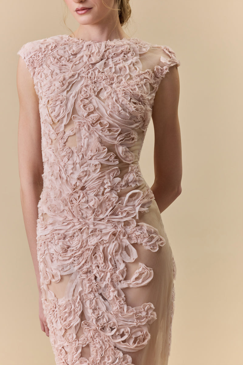 A tulle fitted dress fully embellished with intricate crepe georgette trims.