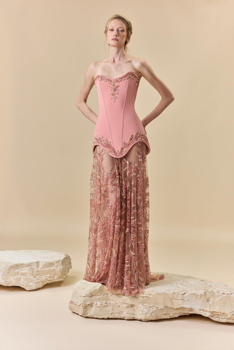 A two-piece ensemble featuring a crepe strapless short dress and a floor-length A-line tulle fully beaded skirt.