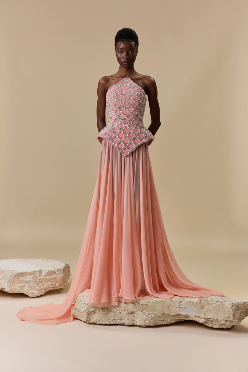 A crêpe corset beaded with crystals and paired with a flowing chiffon A-line skirt.