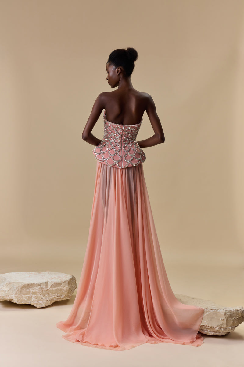 A crêpe corset beaded with crystals and paired with a flowing chiffon A-line skirt.