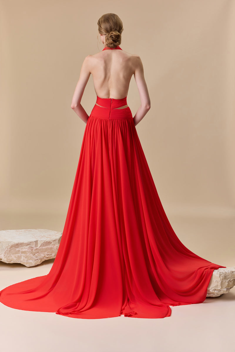 A flowing deep V georgette dress with a knot detail at the waist and a high slit.