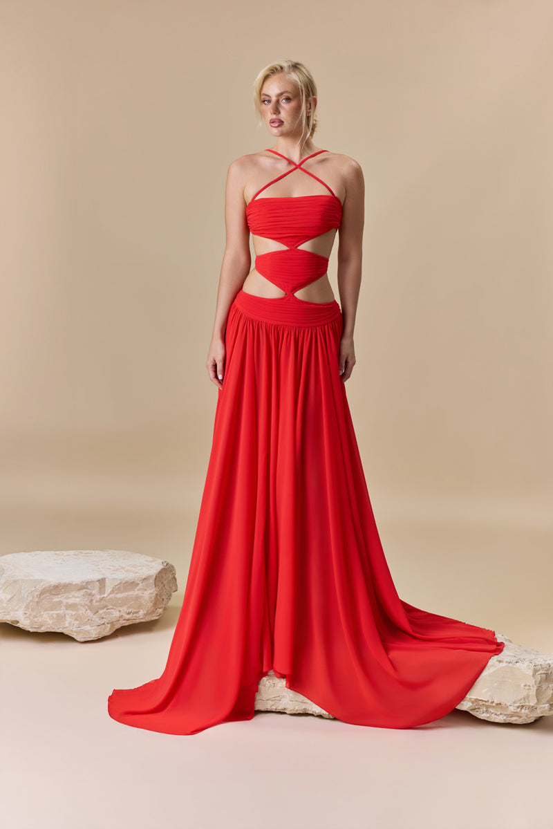 A strapless georgette flowing A-line dress with a draped bodice and waist cutouts.