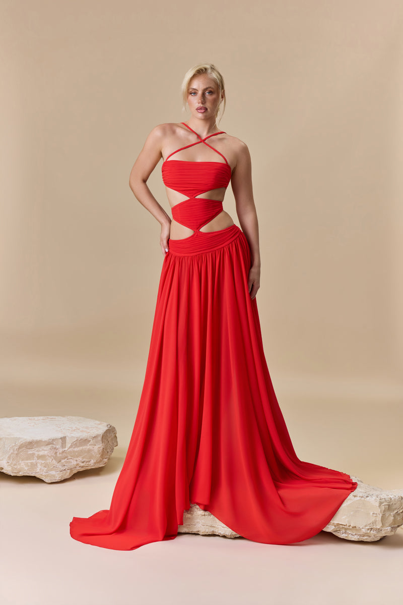 A strapless georgette flowing A-line dress with a draped bodice and waist cutouts.