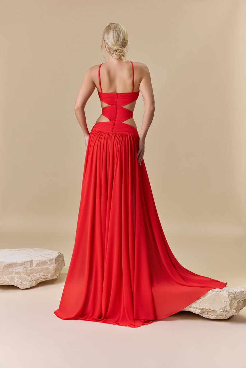 A strapless georgette flowing A-line dress with a draped bodice and waist cutouts.