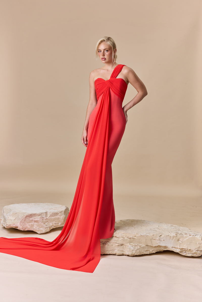A fitted crepe dress with an asymmetric draped georgette neckline.
