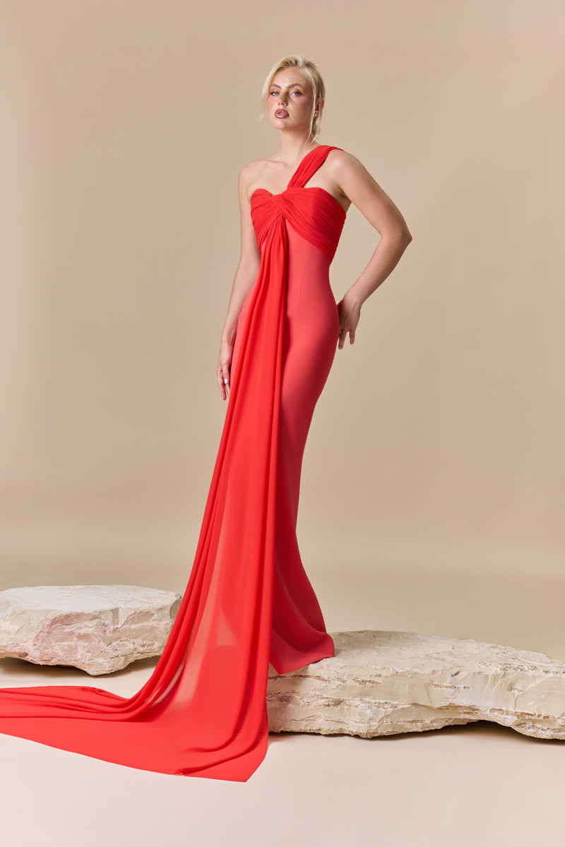 A fitted crepe dress with an asymmetric draped georgette neckline.